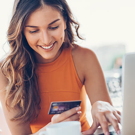 woman smiling while paying bill