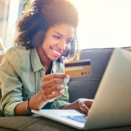 happy woman with credit card